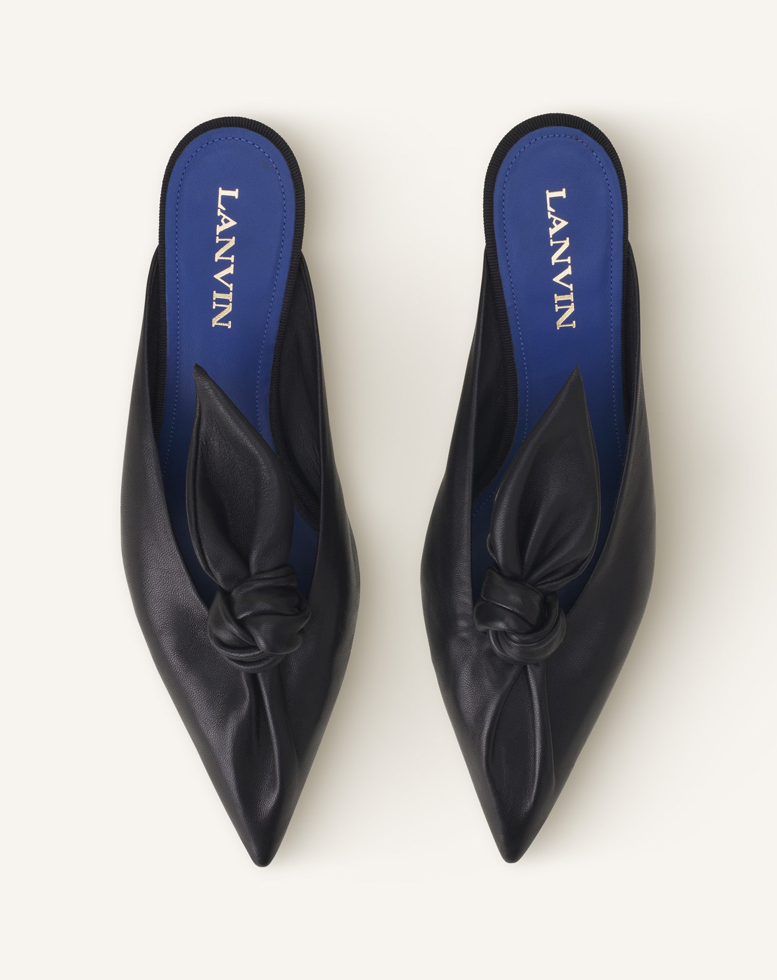 BLACK MIDNIGHT STEP HEELED MULES WITH A LEATHER BOW